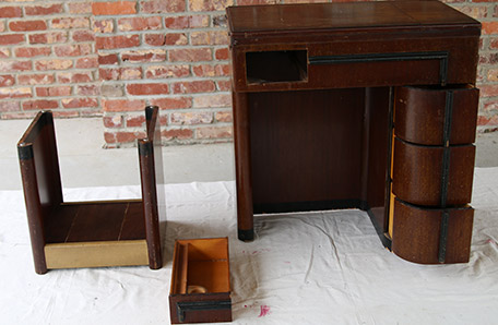 Take the drawers out of the sewing station to get ready for paint