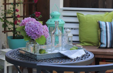 The louvered screen and well-placed seating hides our ugly air conditioner